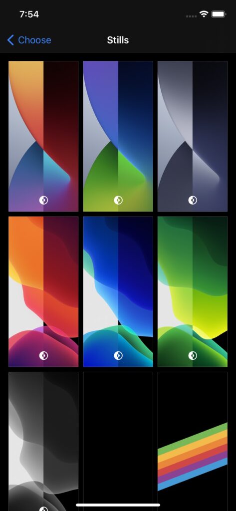 A screenshot from an iPhone showing some wallpaper options that change depending on whether or not dark mode is enabled.
